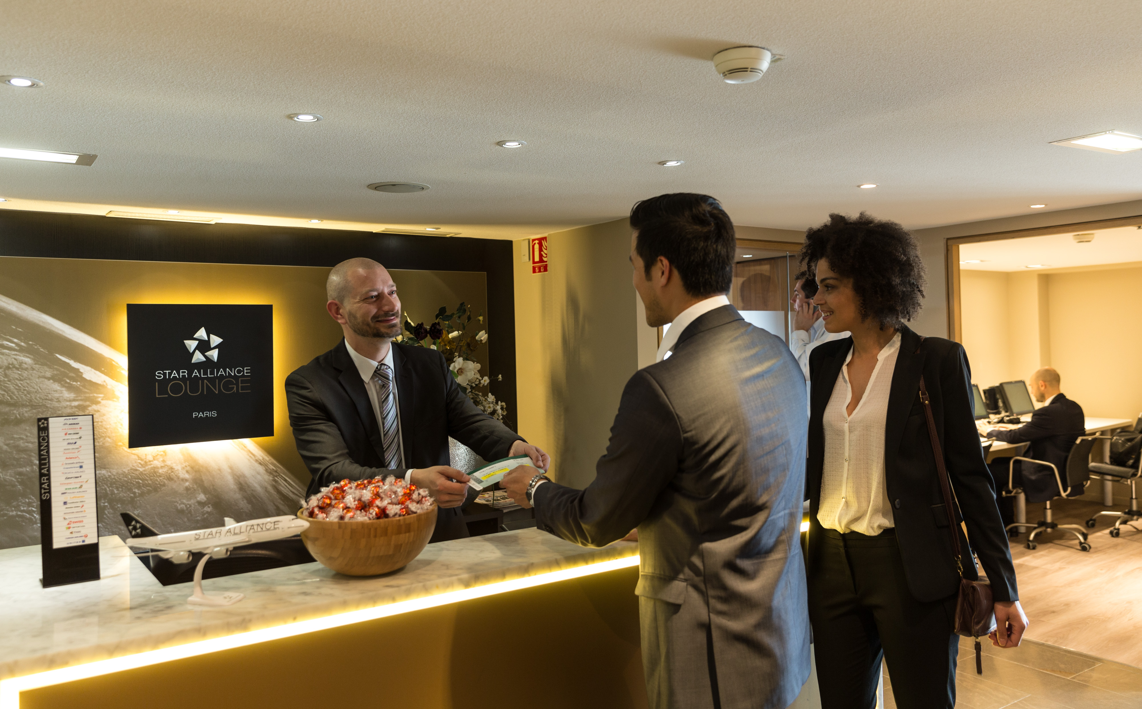 Passengers being welcomed to the Star Alliance Lounge